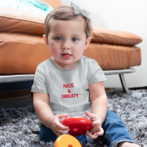 sublimated-t-shirt-mockup-of-a-baby-girl-playing-with-toys-m937